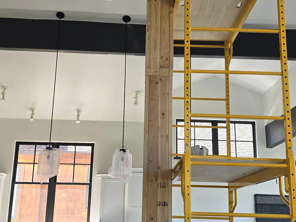 High-wall finish work around recessed lighting