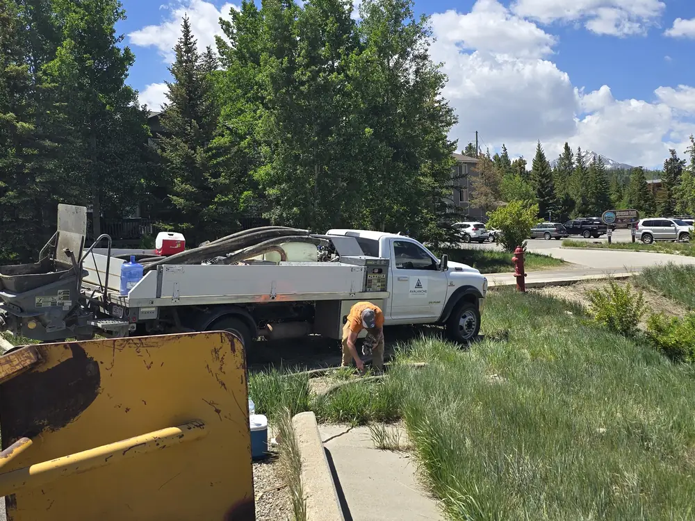 Crew placing concrete for a commercial walkway