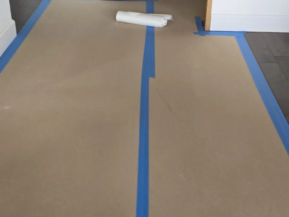 Interior floor masked and protected before painting