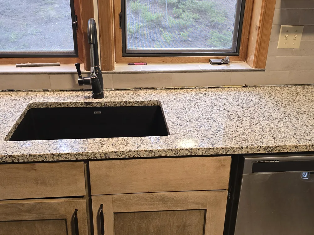 A finished, guest-ready kitchen counter and sink