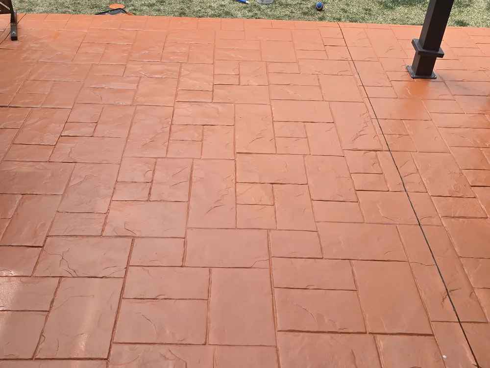 A finished, presentable stamped-concrete patio